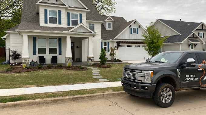 Fox Roofing truck parked at a freshly re-roofed two-story Springtown home